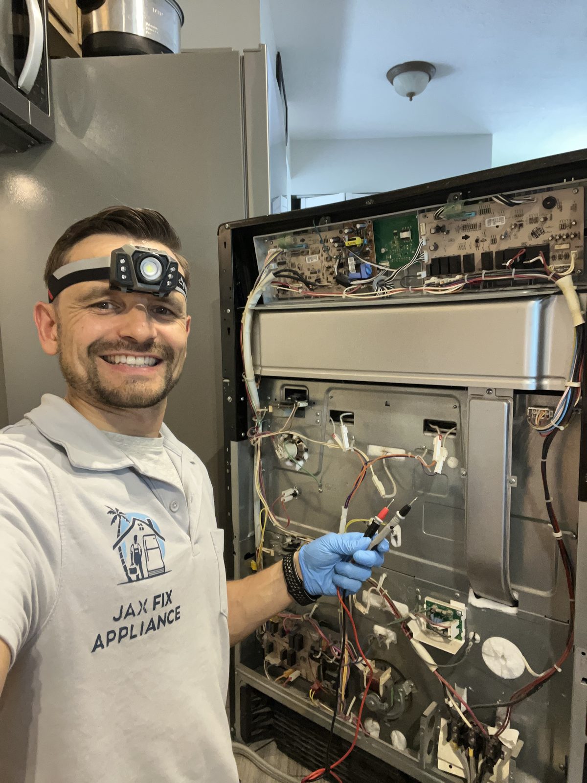Konstantin diagnosing range control board wiring with the back panel open