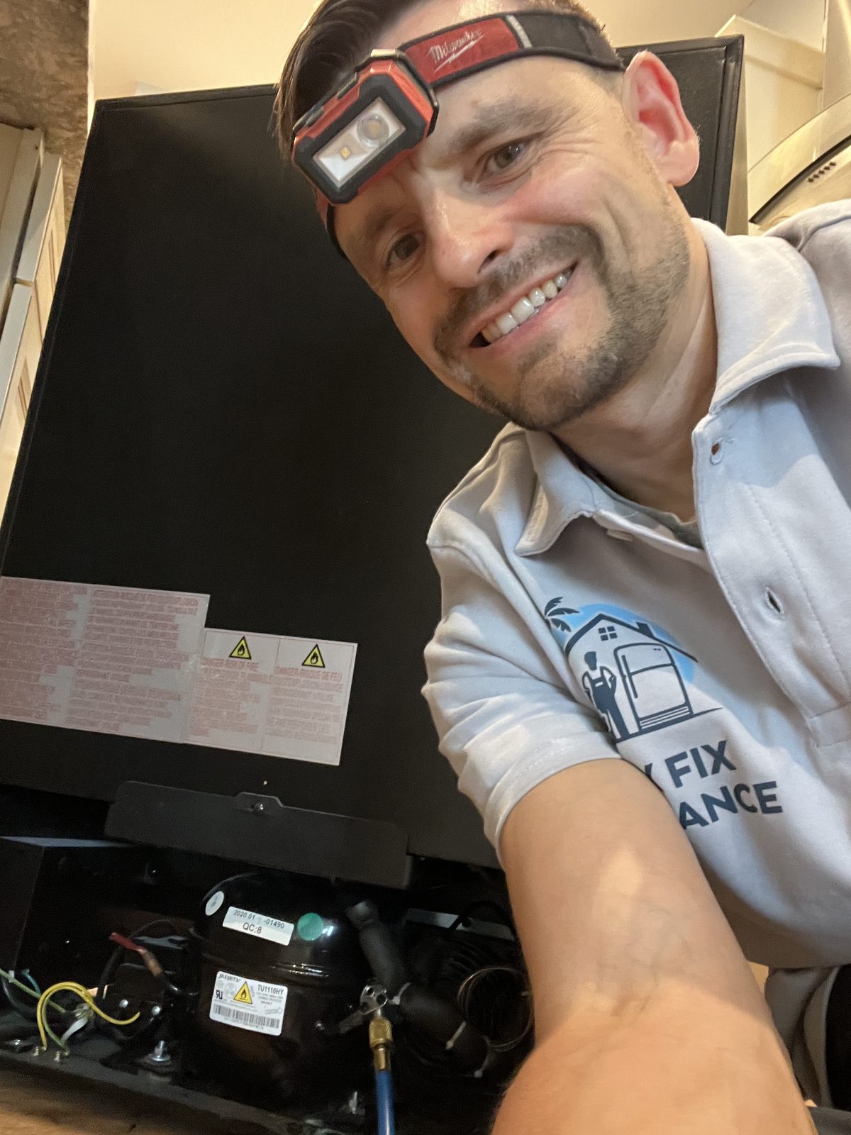 Konstantin recharging the compressor system of a wine cooler